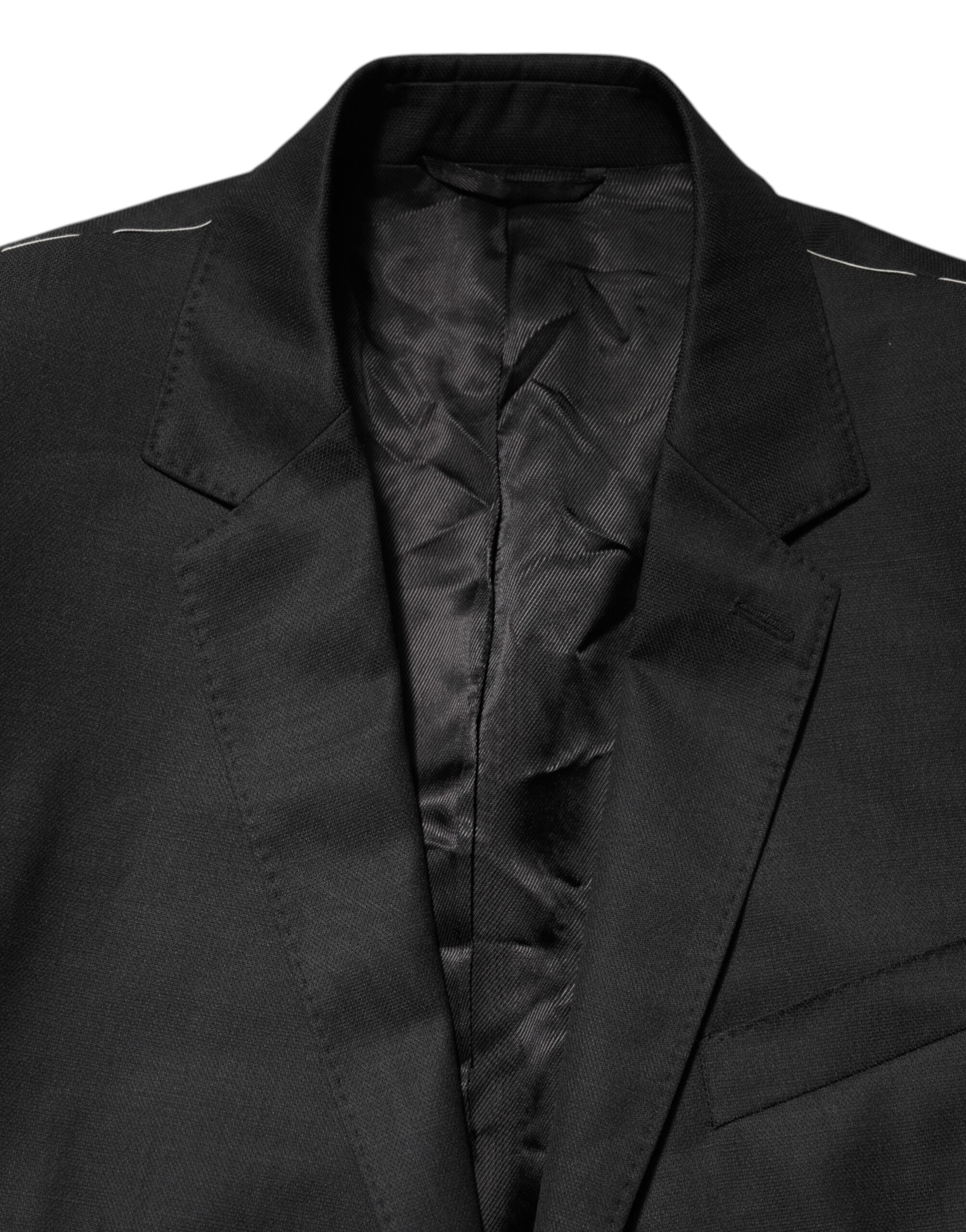 Manteau pour homme Dolce & Gabbana noir à un seul bouton, blazer Martini élégant, en tissu classique, porté sur un mannequin.