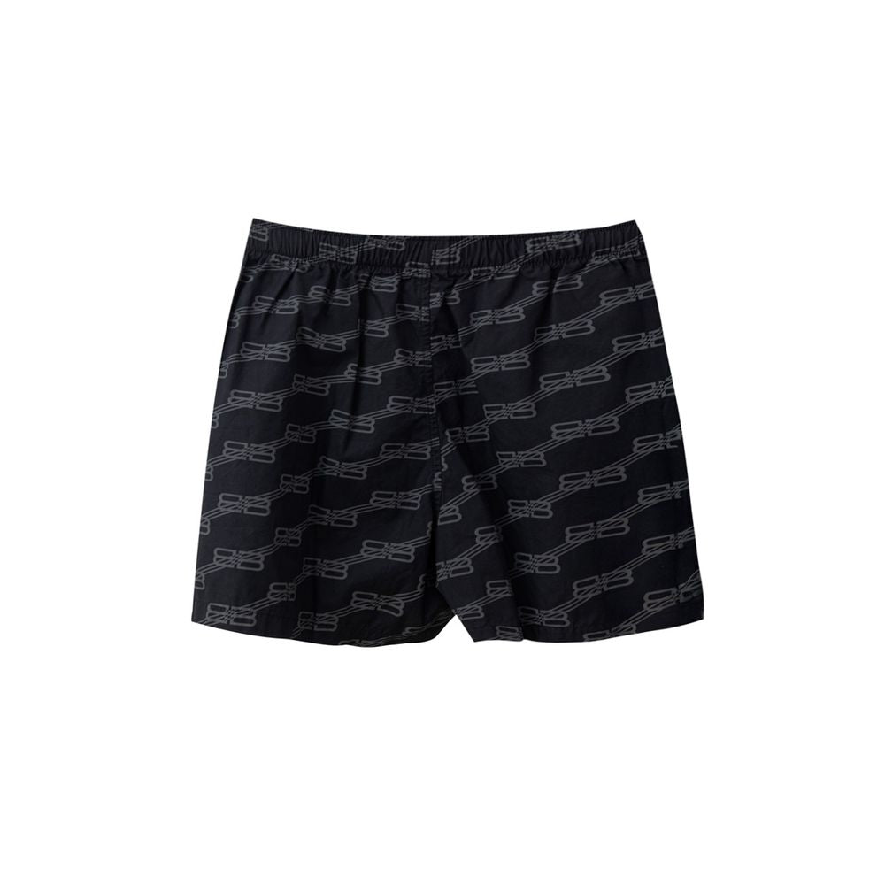 Shorts bermuda noirs en coton de Balenciaga, coupe décontractée et moderne, avec logo discret visible sur le devant.