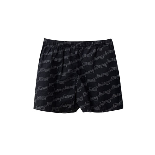 Shorts bermuda noirs en coton de Balenciaga, coupe décontractée et moderne, avec logo discret visible sur le devant.