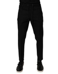 Pantalon jogging skinny en laine noire pour homme de Dolce & Gabbana, vue de face avec détails en tissu élégant