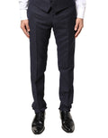 Pantalon homme Dolce & Gabbana en laine grise, pantalon formel élégant avec coupe classique et finition soignée.