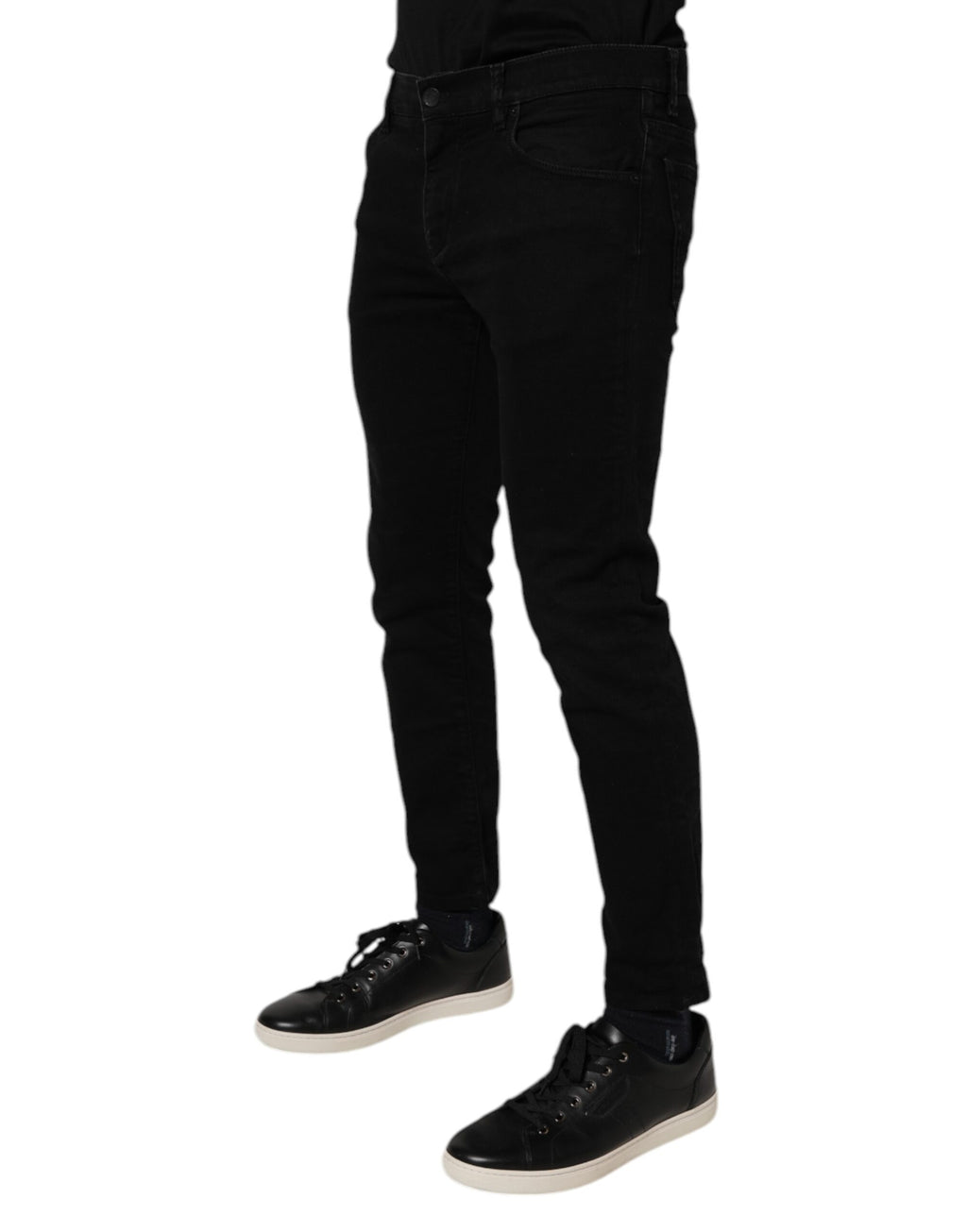 Jeans skinny en coton stretch noir de Dolce & Gabbana pour homme, denim ajusté et élégant, visible en détail.