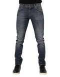 Jean homme skinny en denim blanc lavé Dolce & Gabbana, coupe ajustée, détails classiques et fermeture éclair visible.