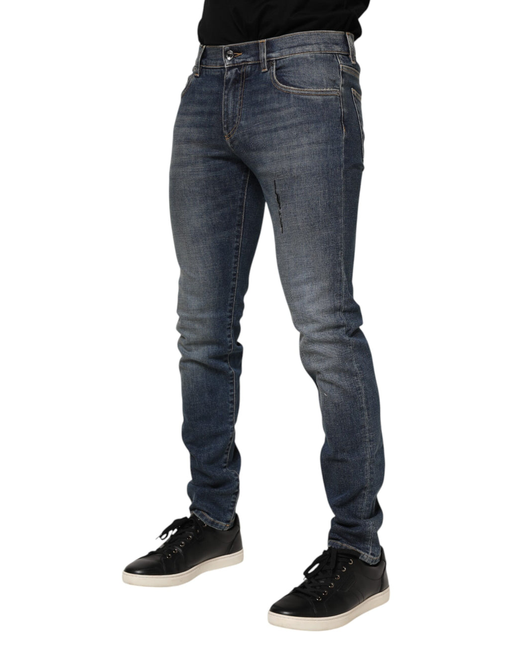 Jeans skinny en coton délavé bleu Dolce & Gabbana pour hommes, vue de face avec détails de la coupe et de la texture denim.