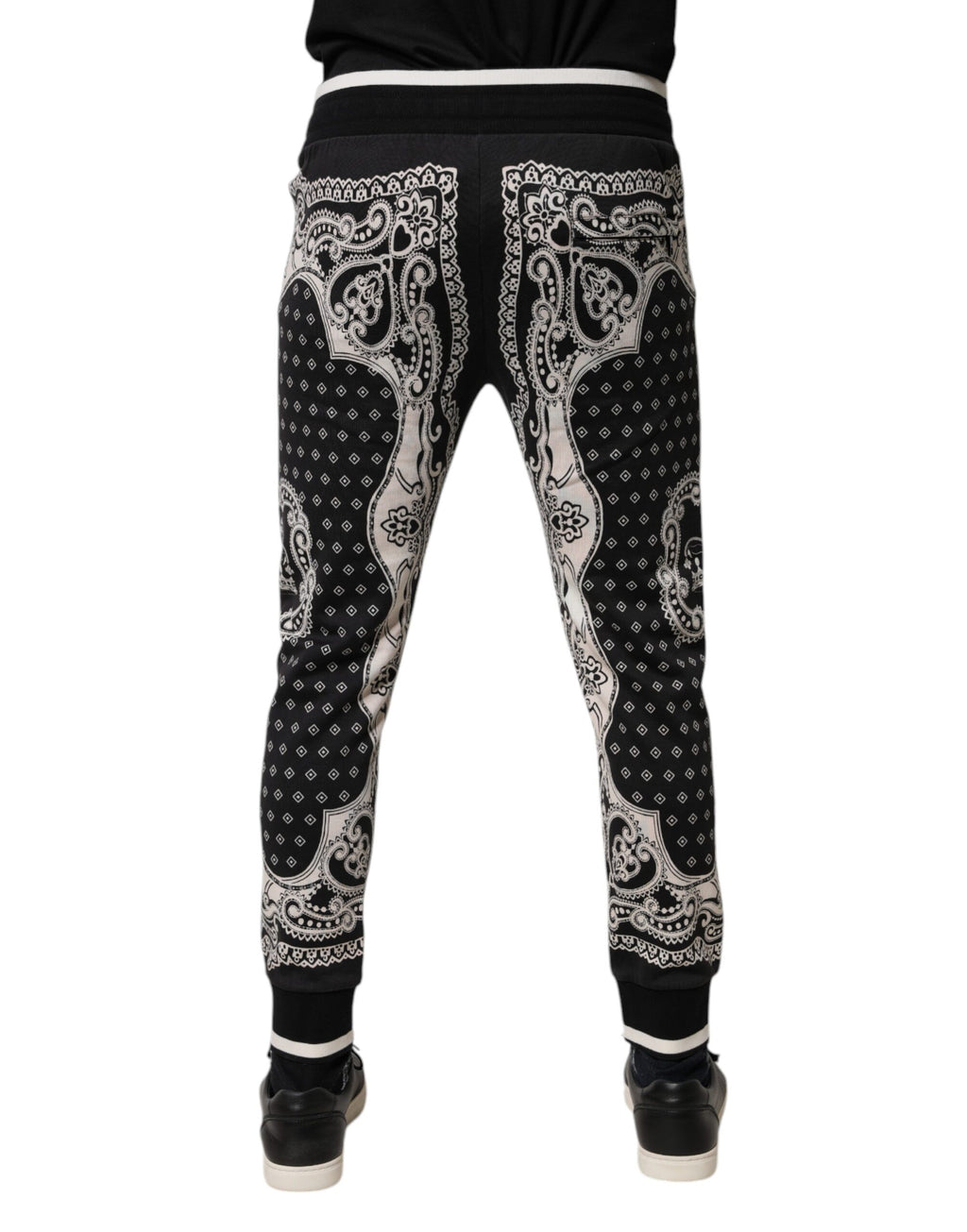 Pantalons joggers Dolce & Gabbana en coton noir avec bande, style décontracté, vue de face sur le produit.