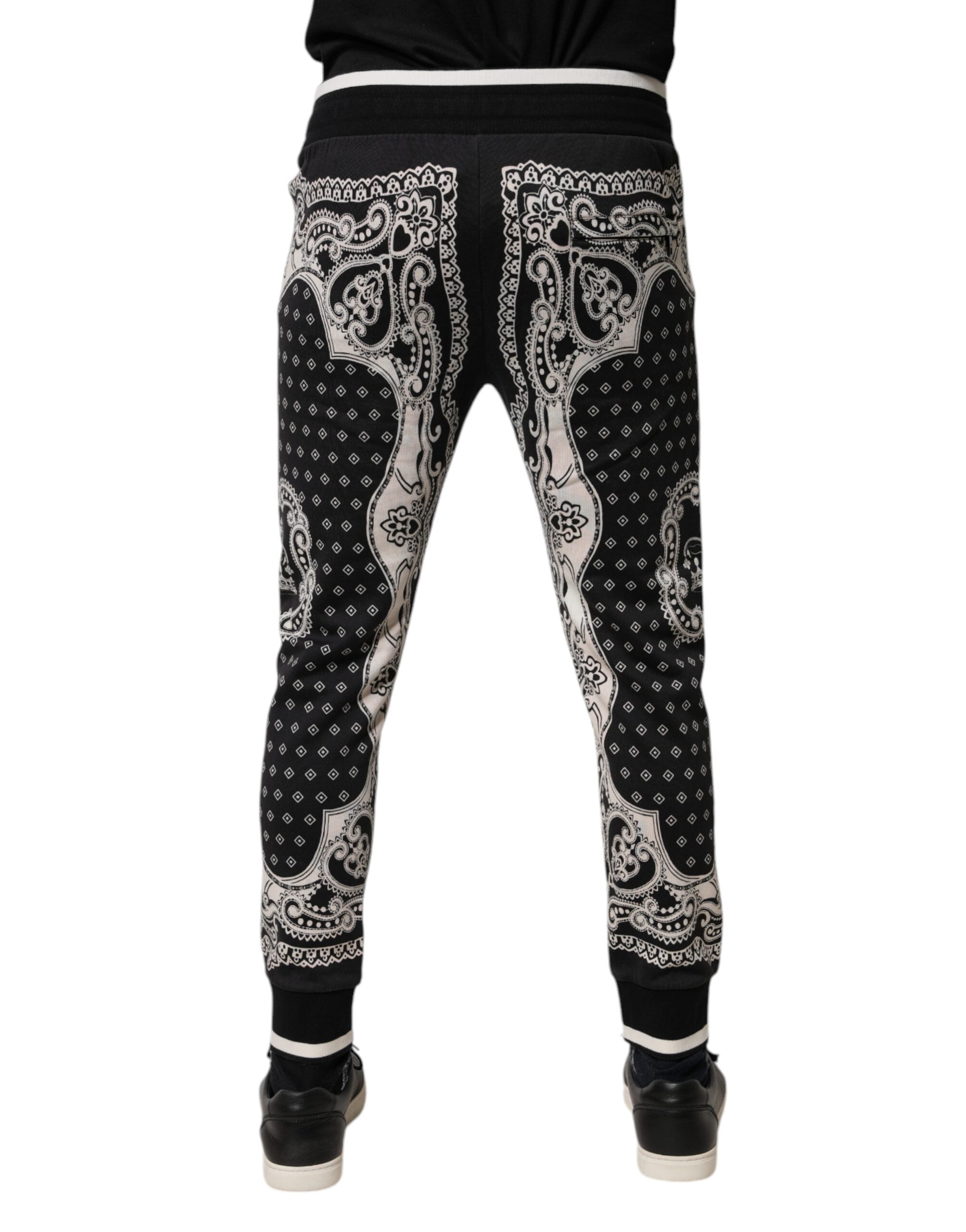 Pantalons joggers Dolce & Gabbana en coton noir avec bande, style décontracté, vue de face sur le produit.