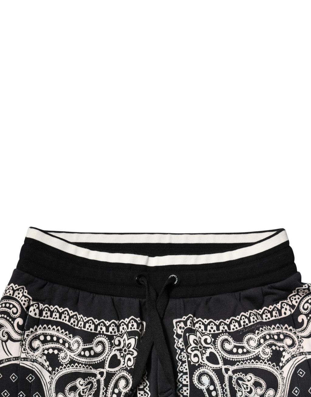 Pantalon de survêtement noir Dolce & Gabbana en coton avec bandeau, jogger, design moderne, visible détails du tissu et de la coupe.