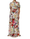 Robe longue en soie blanche à imprimé floral Dolce & Gabbana, coupe ajustée et élégante.
