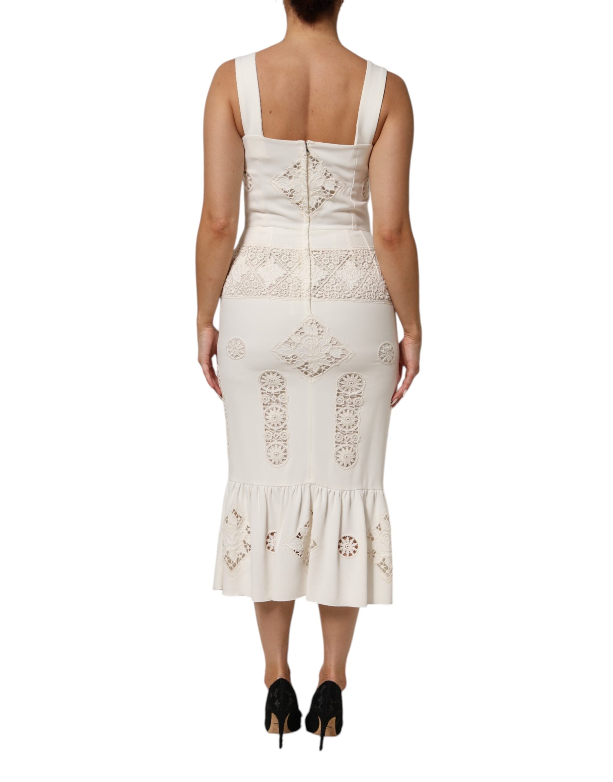 Robe midi sans manches Dolce & Gabbana en dentelle blanche à motifs floraux, élégance raffinée et détails délicats visible sur l'image.