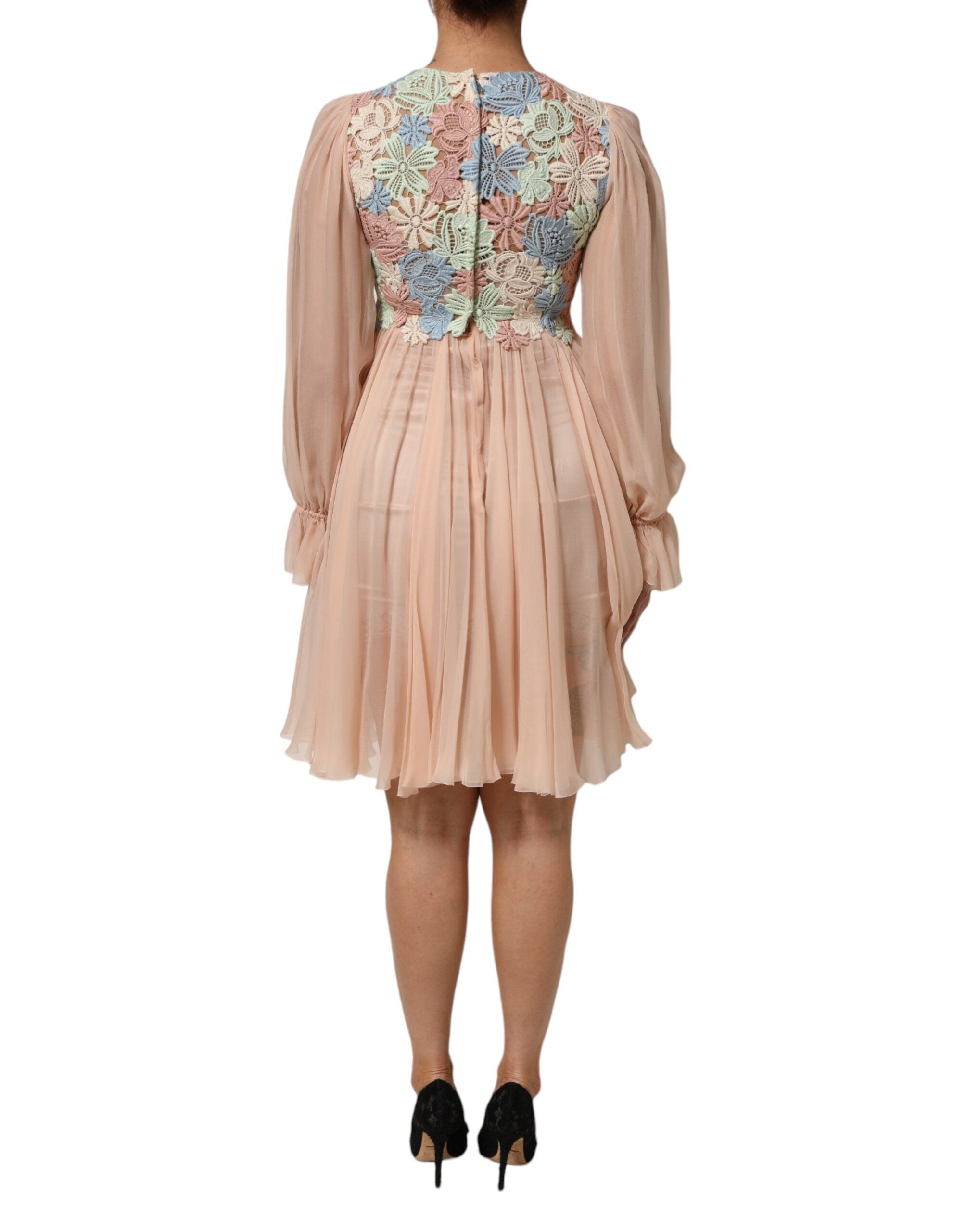 Robe plissée A-line rose avec broderie florale en dentelle rose de Dolce & Gabbana, style élégant et féminin.