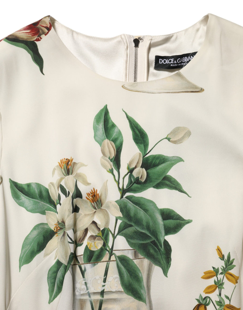 Robe midi en soie blanche Dolce & Gabbana avec motif floral, coupe ajustée et élégante, parfaite pour une tenue sophistiquée.