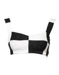 Haut bustier corset noir et blanc Dolce & Gabbana, coupe courte, détails structurés, tissu élégant et moderne.