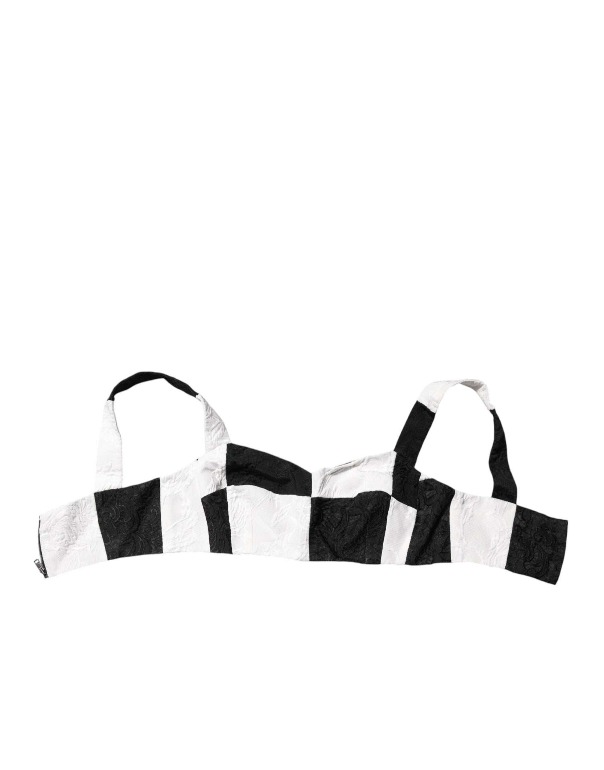 Corset bustier court noir et blanc de Dolce & Gabbana, vêtement tendance avec détails élégants, porté ajusté et sophistiqué.
