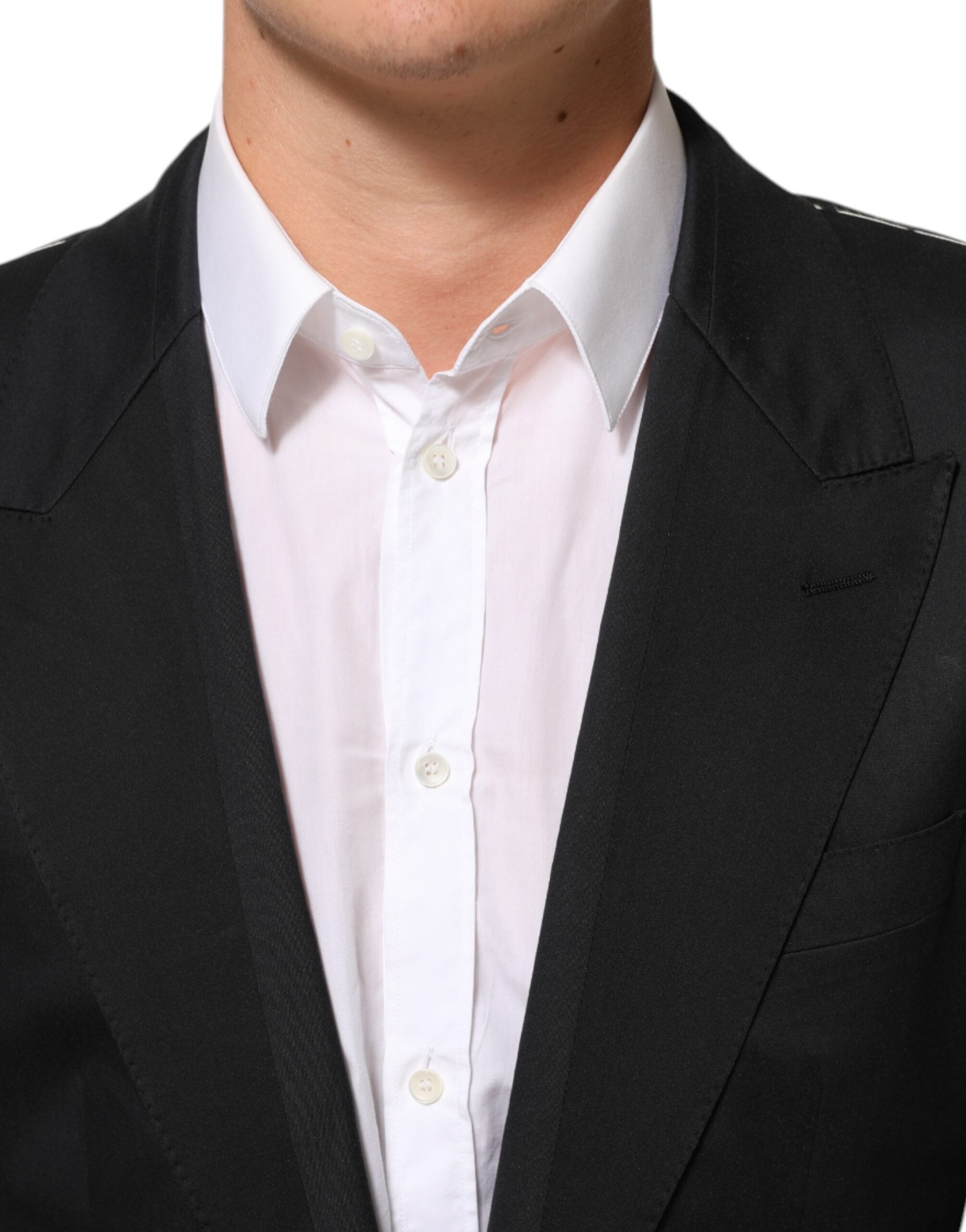 Veste blazer Dolce & Gabbana noire en coton avec deux boutons, élégante et ajustée, vue de face sur fond neutre.