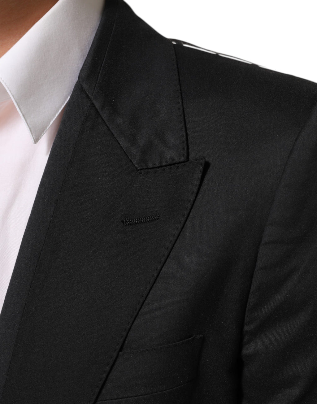 Veste blazer noire en coton Dolce & Gabbana avec deux boutons, élégant et ajusté, sur un mannequin.