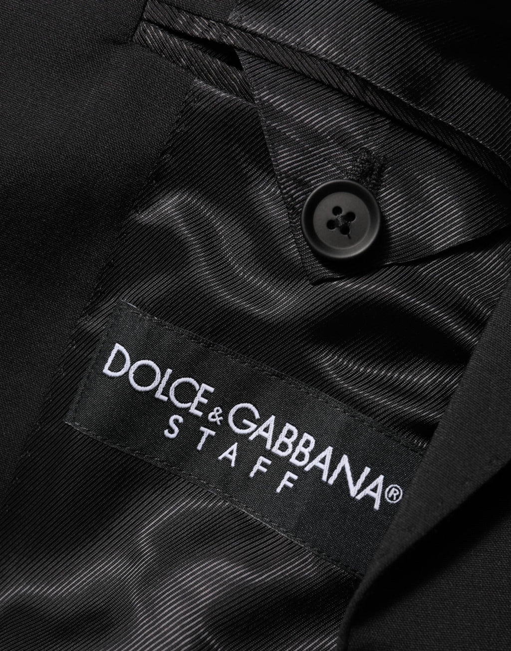 Veste blazer Dolce & Gabbana noire avec deux boutons, style classique et élégant, vue de face sur fond neutre.
