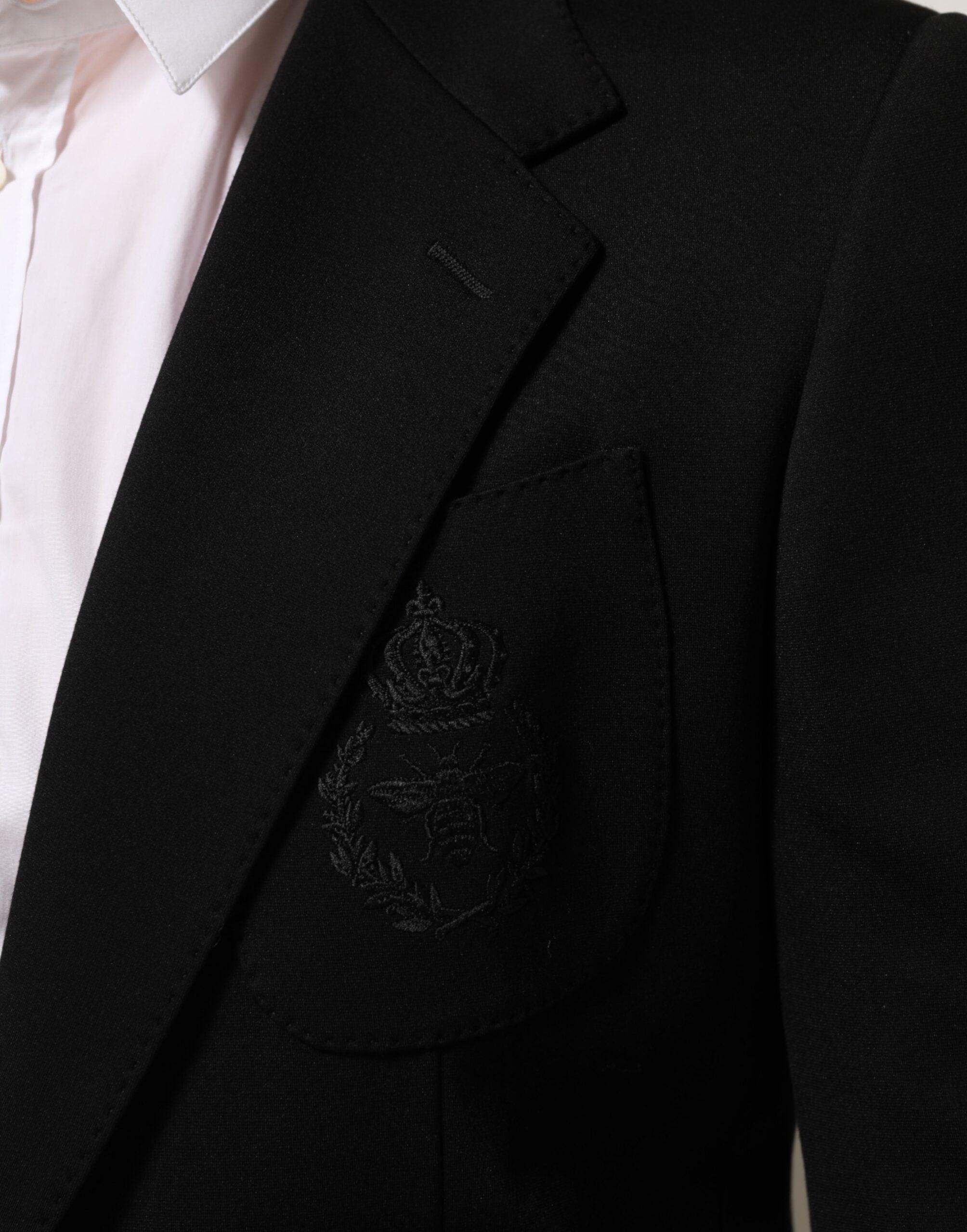 Veste blazer Dolce & Gabbana noire en viscose avec deux boutons, style élégant et ajusté pour homme.