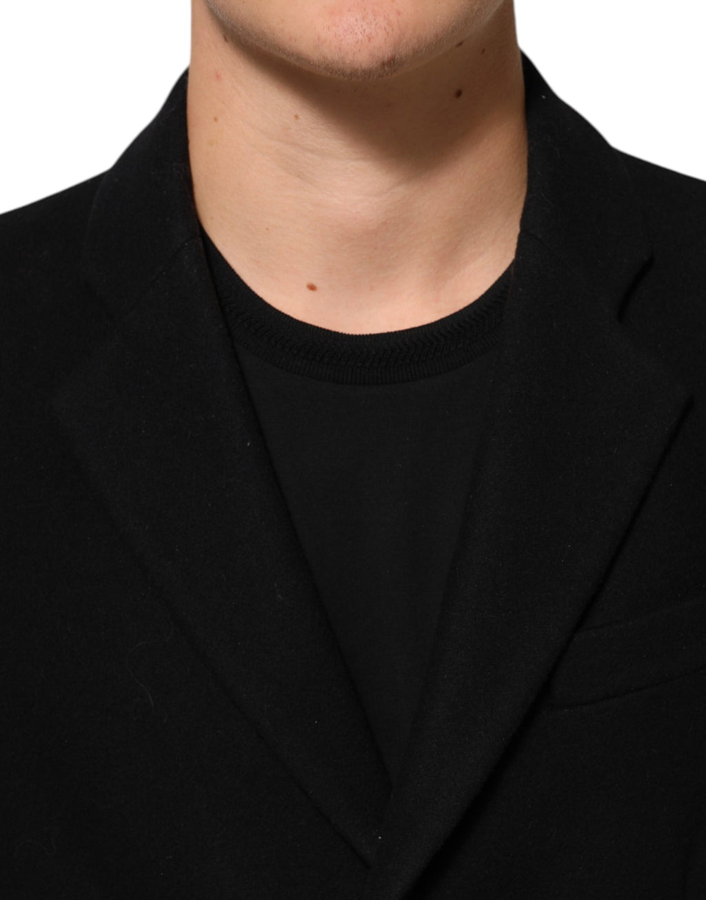 Manteau trench noir en laine pour homme de Dolce & Gabbana avec boutons, style élégant et classique.
