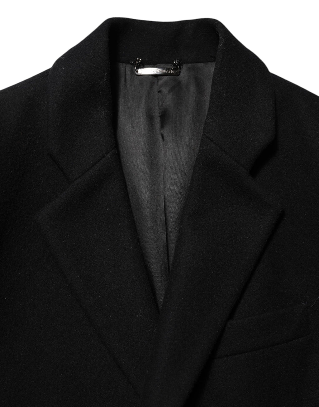 Manteau trench pour homme Dolce & Gabbana en laine noire avec boutons, style élégant et classique.