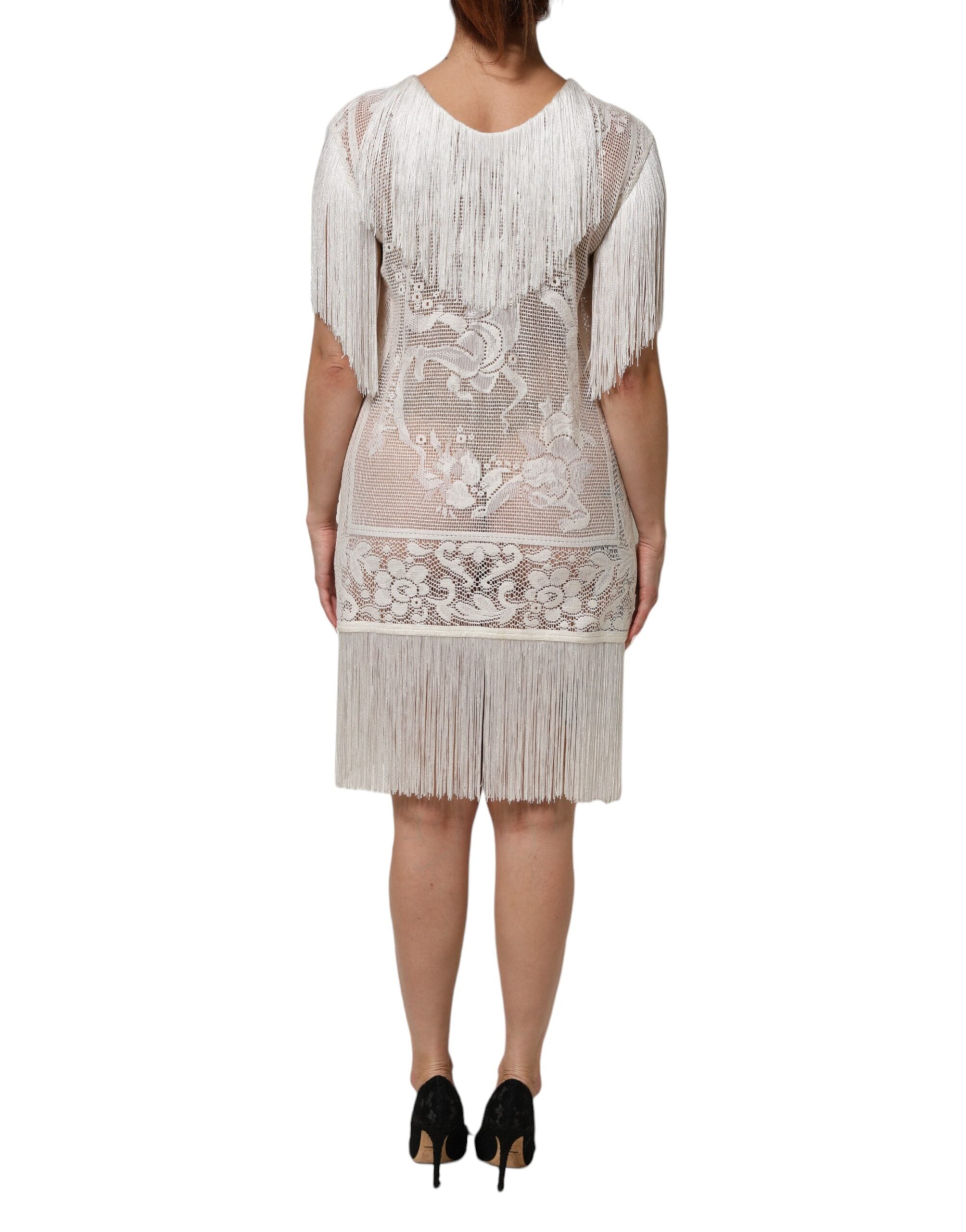 Robe blanche en dentelle florale avec franges, longueur genou, de la marque Dolce & Gabbana.