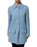 Manteau trench bleu à boutons Dolce & Gabbana, veste élégante avec col et poches visibles.