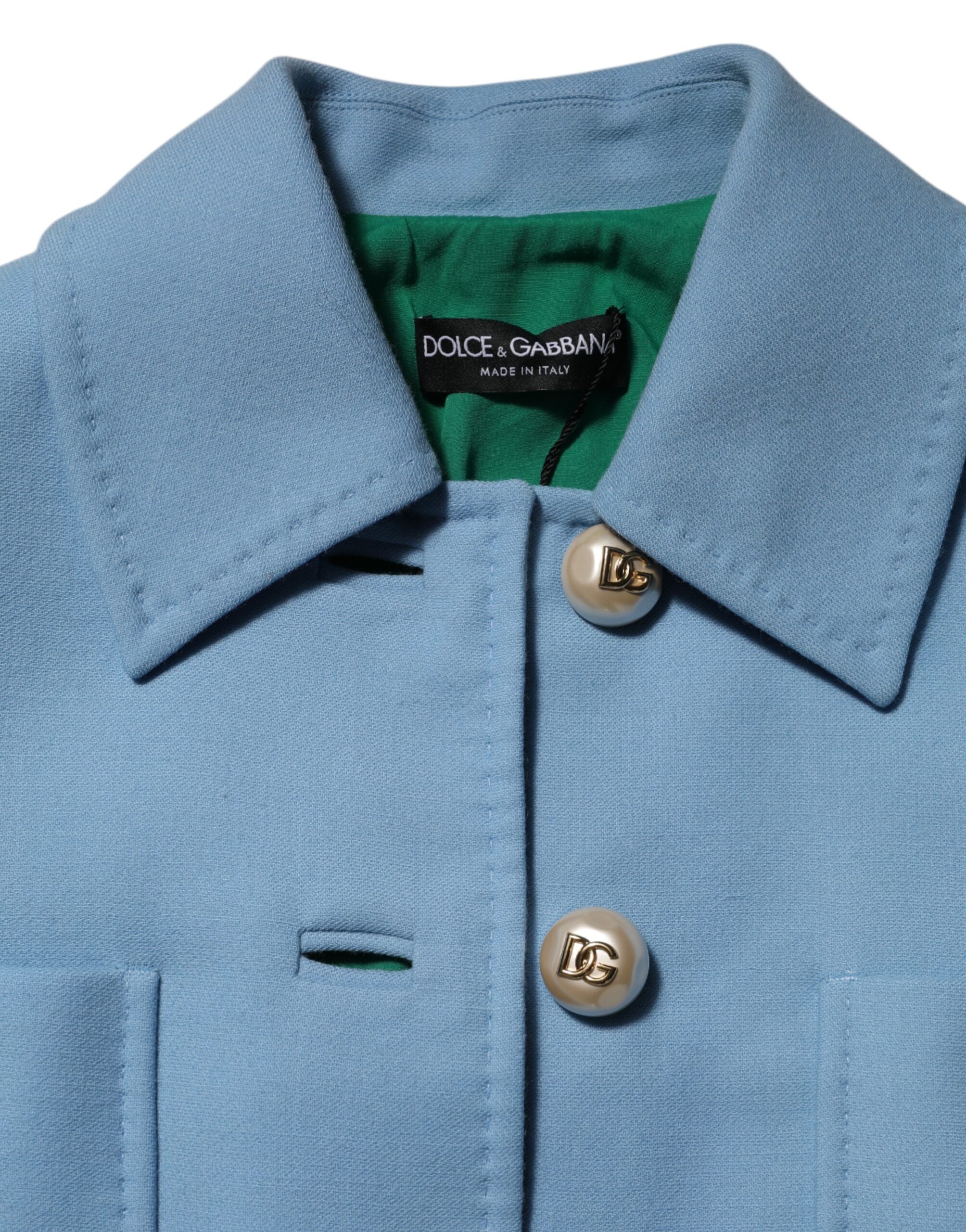 Manteau trench bleu à boutons Dolce & Gabbana, veste élégante avec col et poches visibles, en tissu léger.
