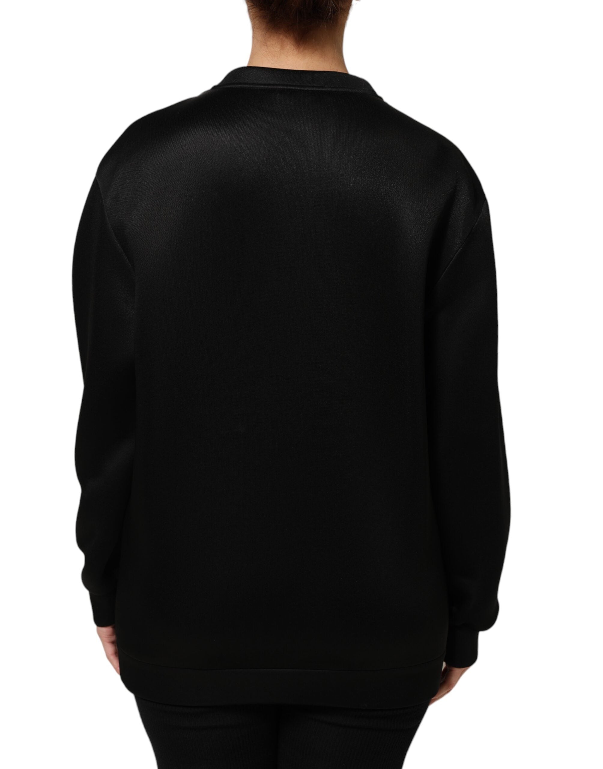 Pull à capuche Dolce & Gabbana noir avec logo en cristal DG, orné d'un collier en pendentif noir et cristal.