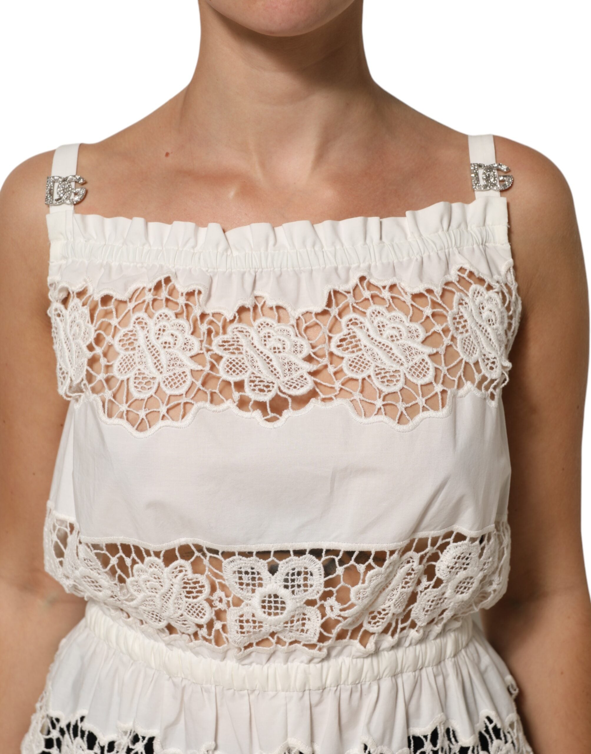 Débardeur Dolce & Gabbana en popeline blanche avec broderie ajourée, léger et élégant, parfait pour un look sophistiqué.