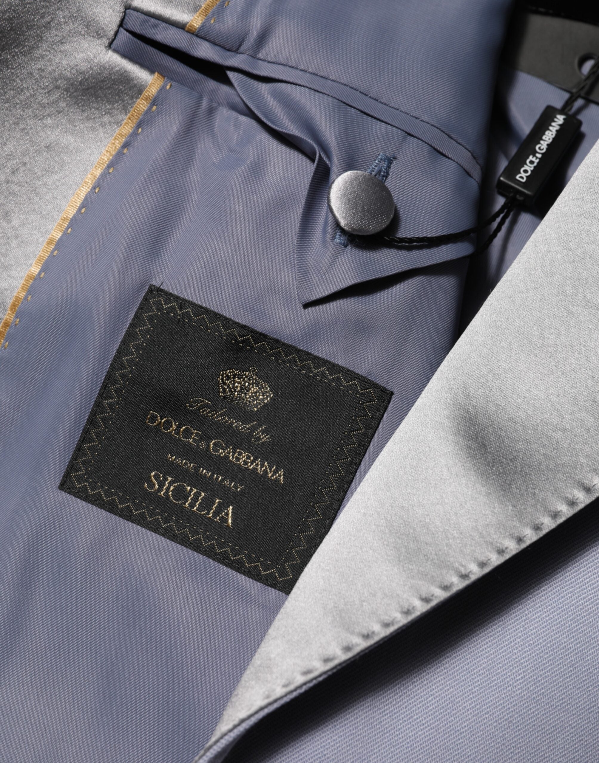 Costume homme Dolce & Gabbana en laine grise Sicilia avec deux boutons, blazer élégant et classique.