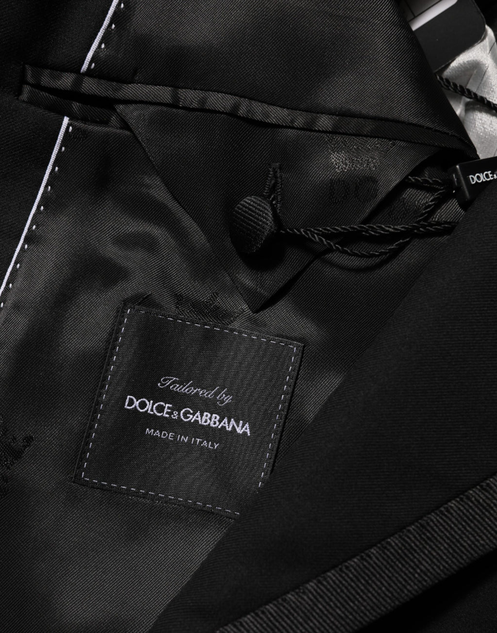 Veste blazer Dolce & Gabbana pour homme en laine noire à un bouton, style élégant et moderne.