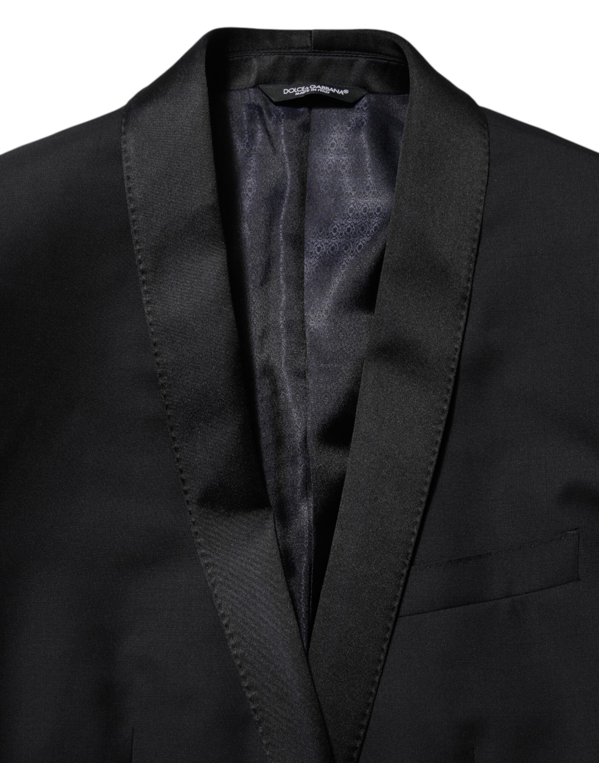 Veste blazer noire Dolce & Gabbana avec bouton doré, costume pour homme élégant et sophistiqué.