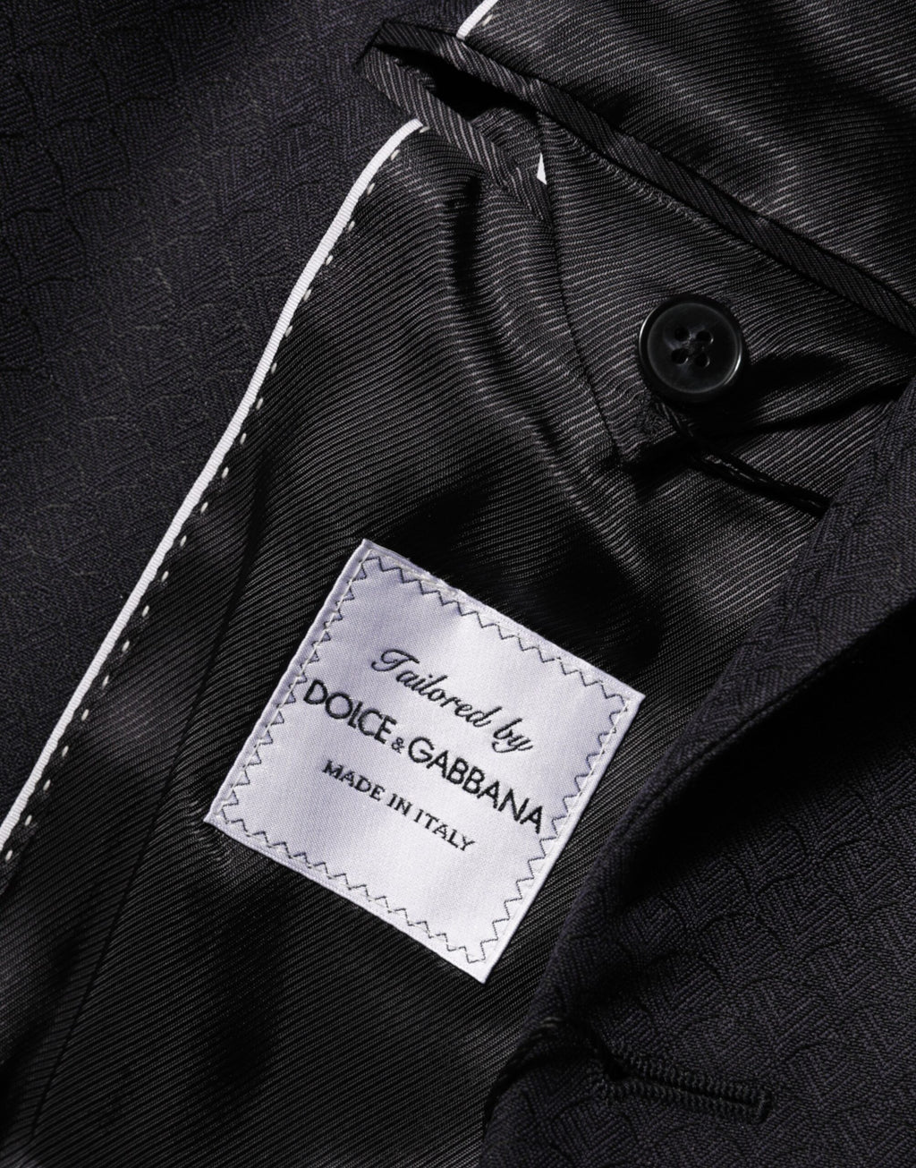 Veste blazer homme Dolce & Gabbana en laine noire avec deux boutons, style élégant et classique.