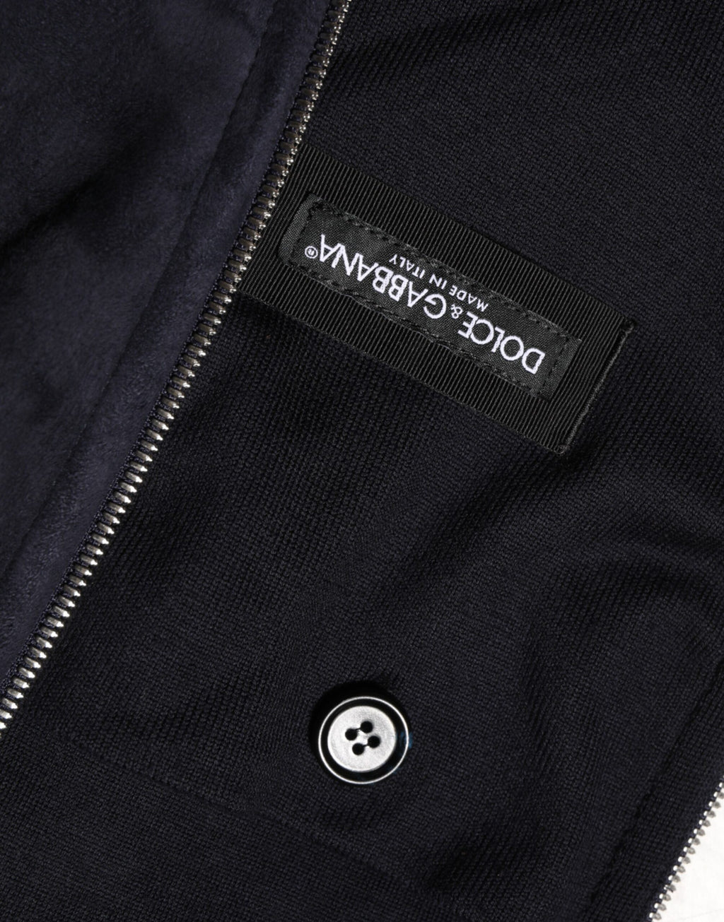 Veste blouson Dolce & Gabbana en cuir noir avec capuche et fermeture éclair complète, décontractée et élégante.