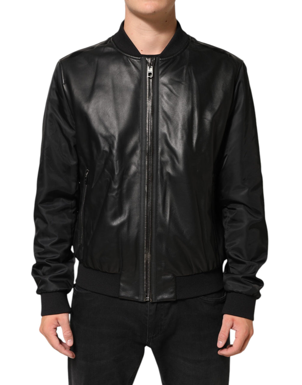 Blouson Dolce & Gabbana en cuir noir et nylon avec fermeture éclair complète, style élégant et moderne.