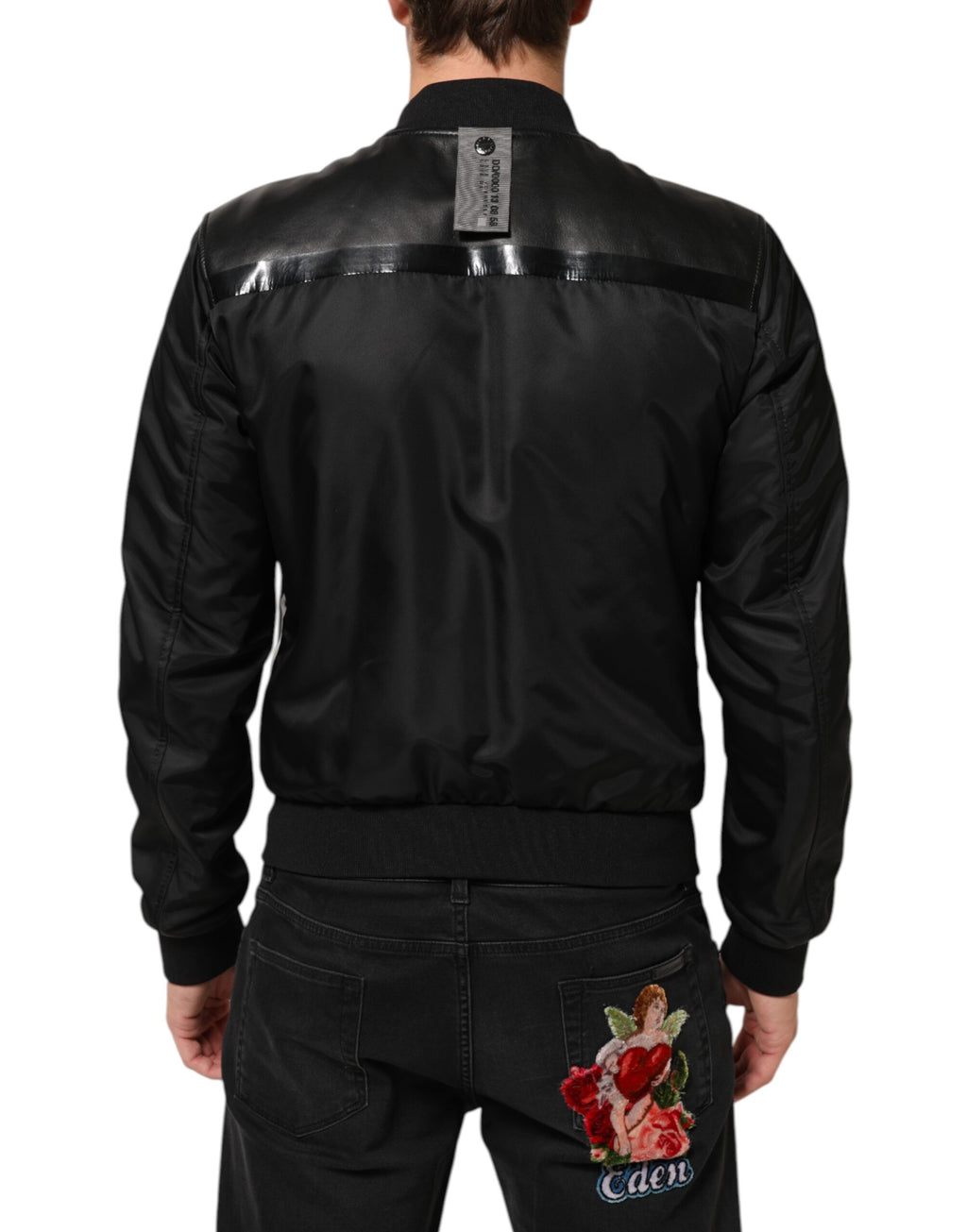 Veste blouson Dolce & Gabbana en cuir noir et nylon avec fermeture éclair complète, style élégant et moderne.