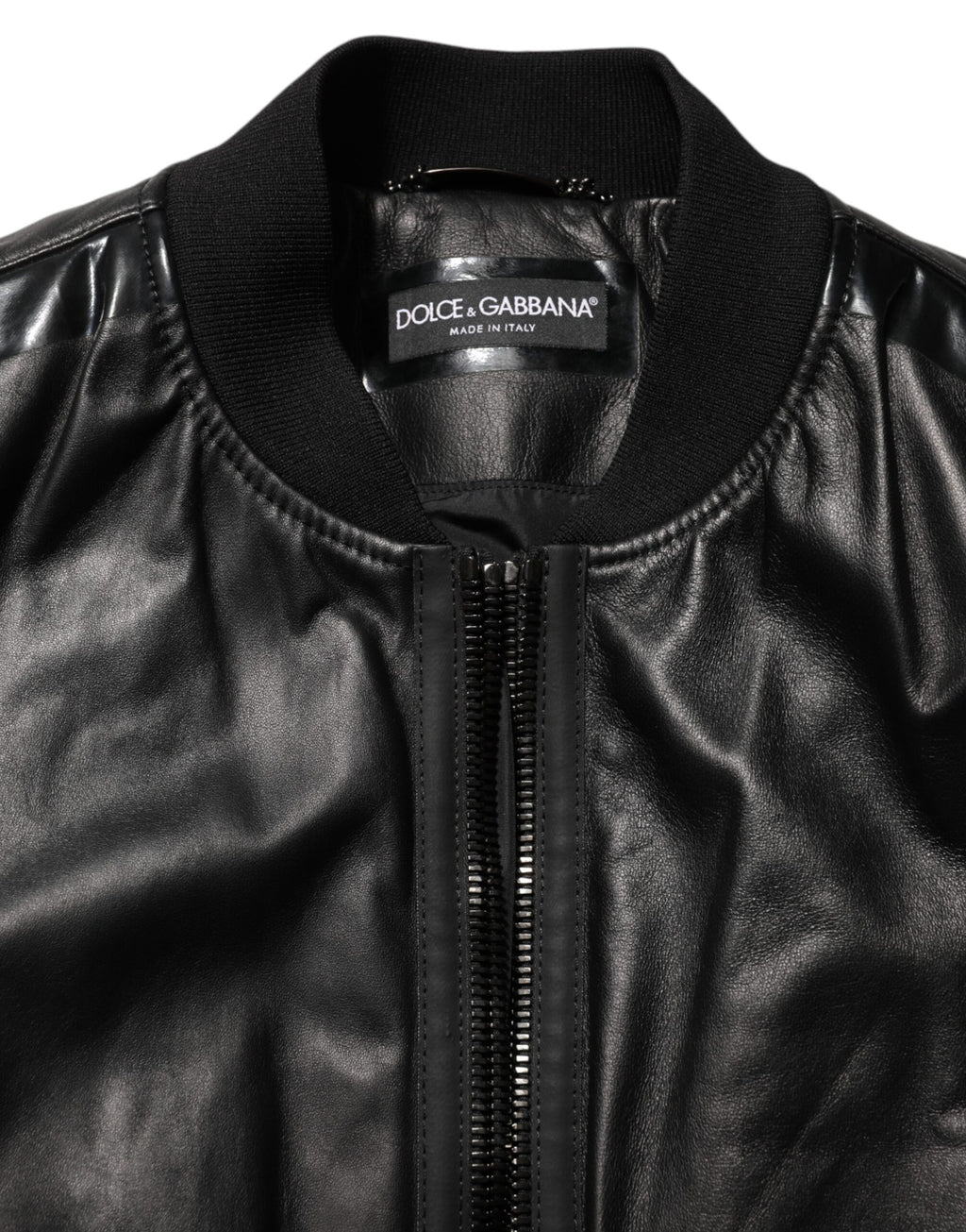 Blouson Dolce & Gabbana en cuir noir et nylon avec fermeture éclair complète, style élégant et moderne.