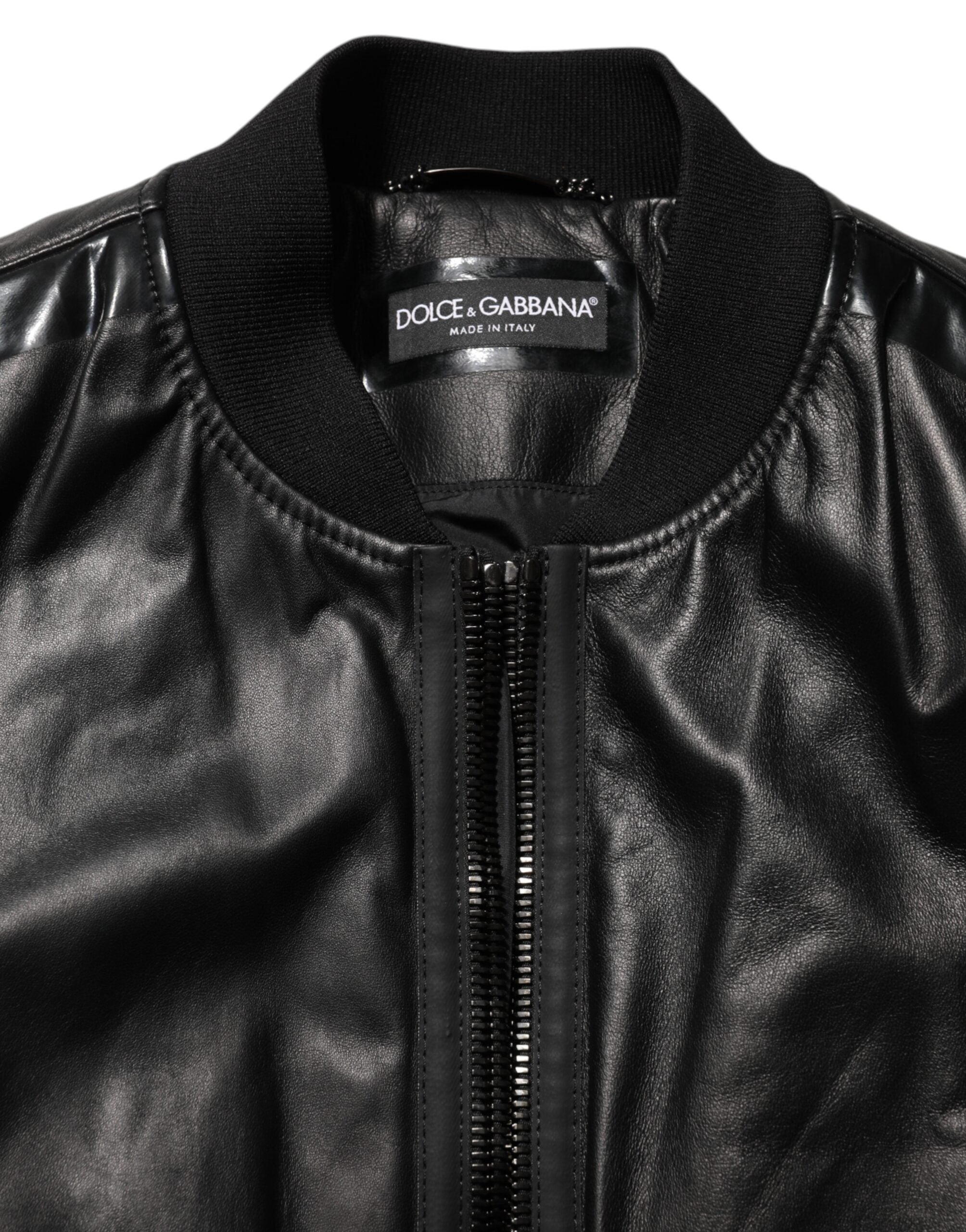 Blouson Dolce & Gabbana en cuir noir et nylon avec fermeture éclair complète, style élégant et moderne.