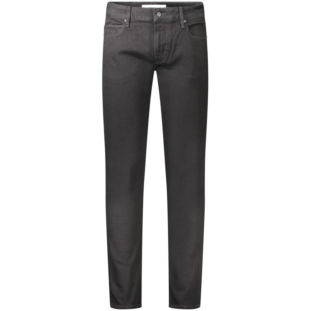 Jeans skinny noirs pour homme Guess Jeans en coton, vue en gros plan sur la texture et la coupe ajustée.