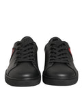 Chaussures Dolce & Gabbana en cuir noir avec cœur en cristal, baskets à la mode et détails élégants.