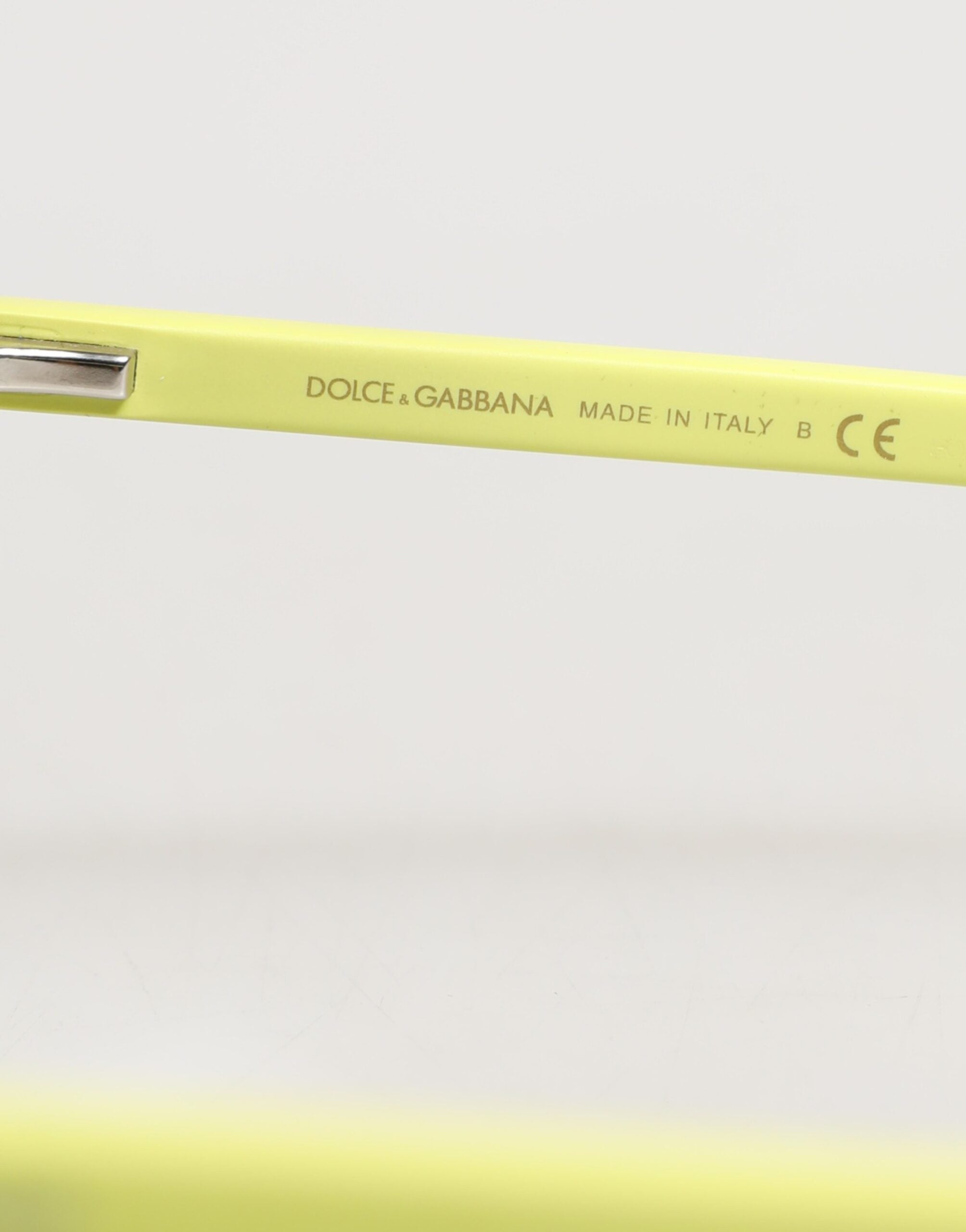 Lunettes de soleil Dolce & Gabbana DG4324 avec monture jaune et verres miroirs, style élégant et moderne.