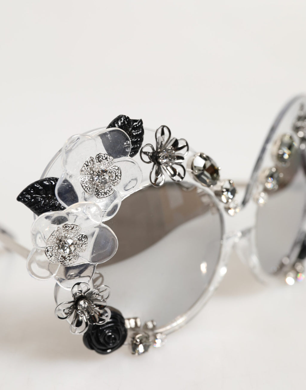 Lunettes de soleil rondes transparentes Dolce & Gabbana DG4292 avec fleurs en cristal, style élégant et sophistiqué.
