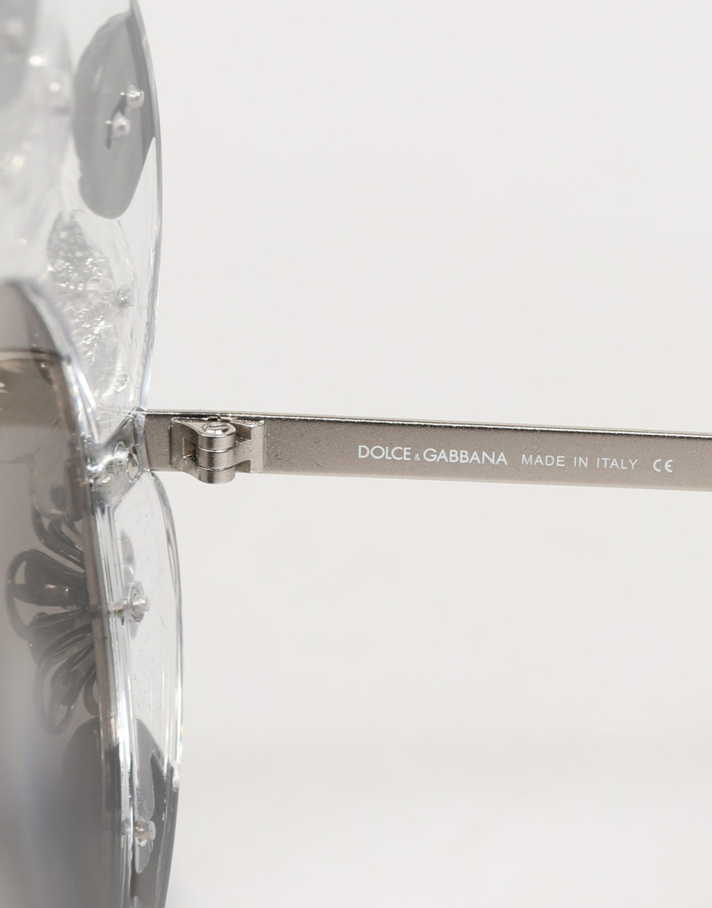Lunettes de soleil rondes Dolce & Gabbana DG4292 transparent avec motifs de fleurs en cristaux.