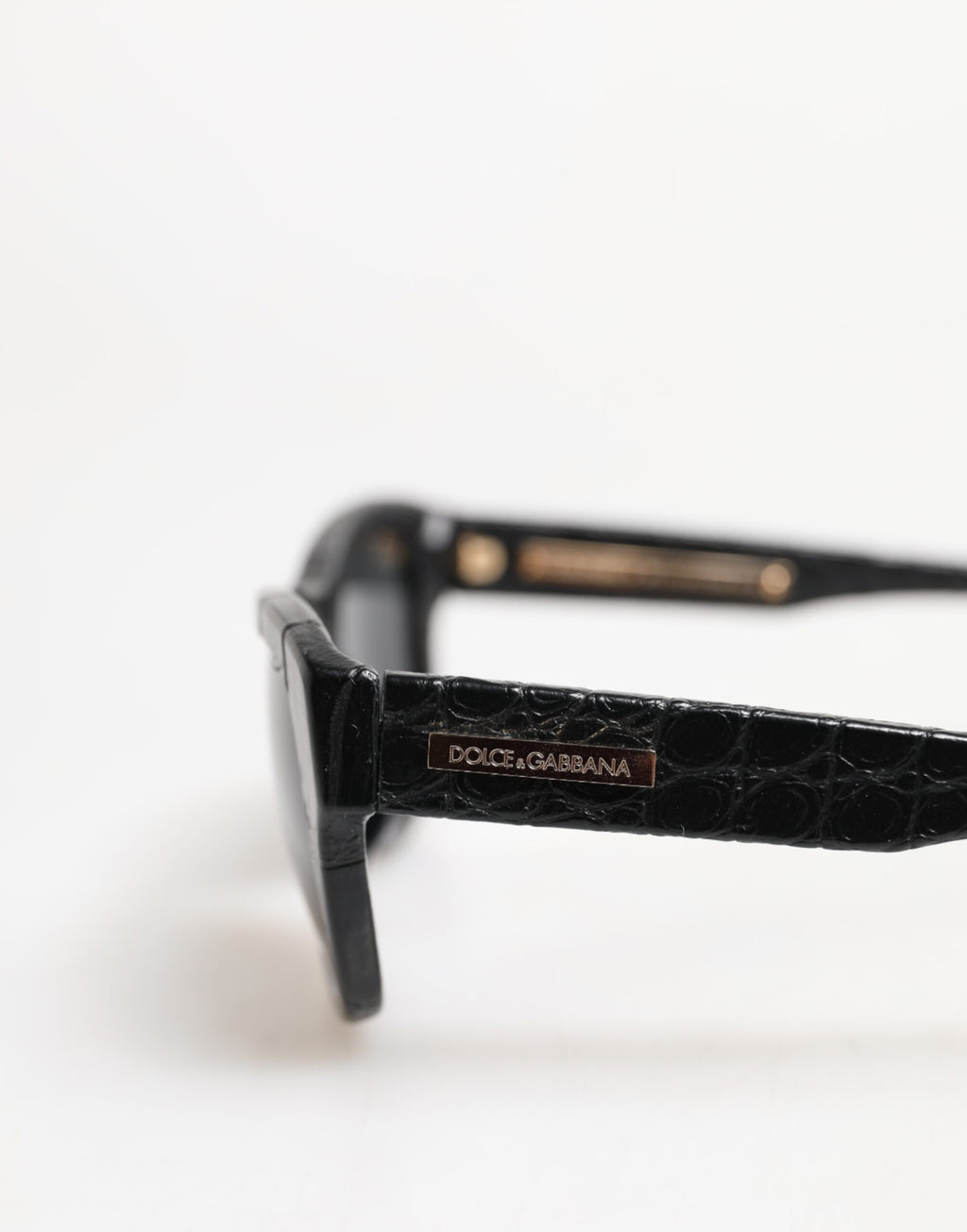 Lunettes de soleil Dolce & Gabbana DG4177 à monture en cuir noir avec verres teintés, style élégant et moderne.