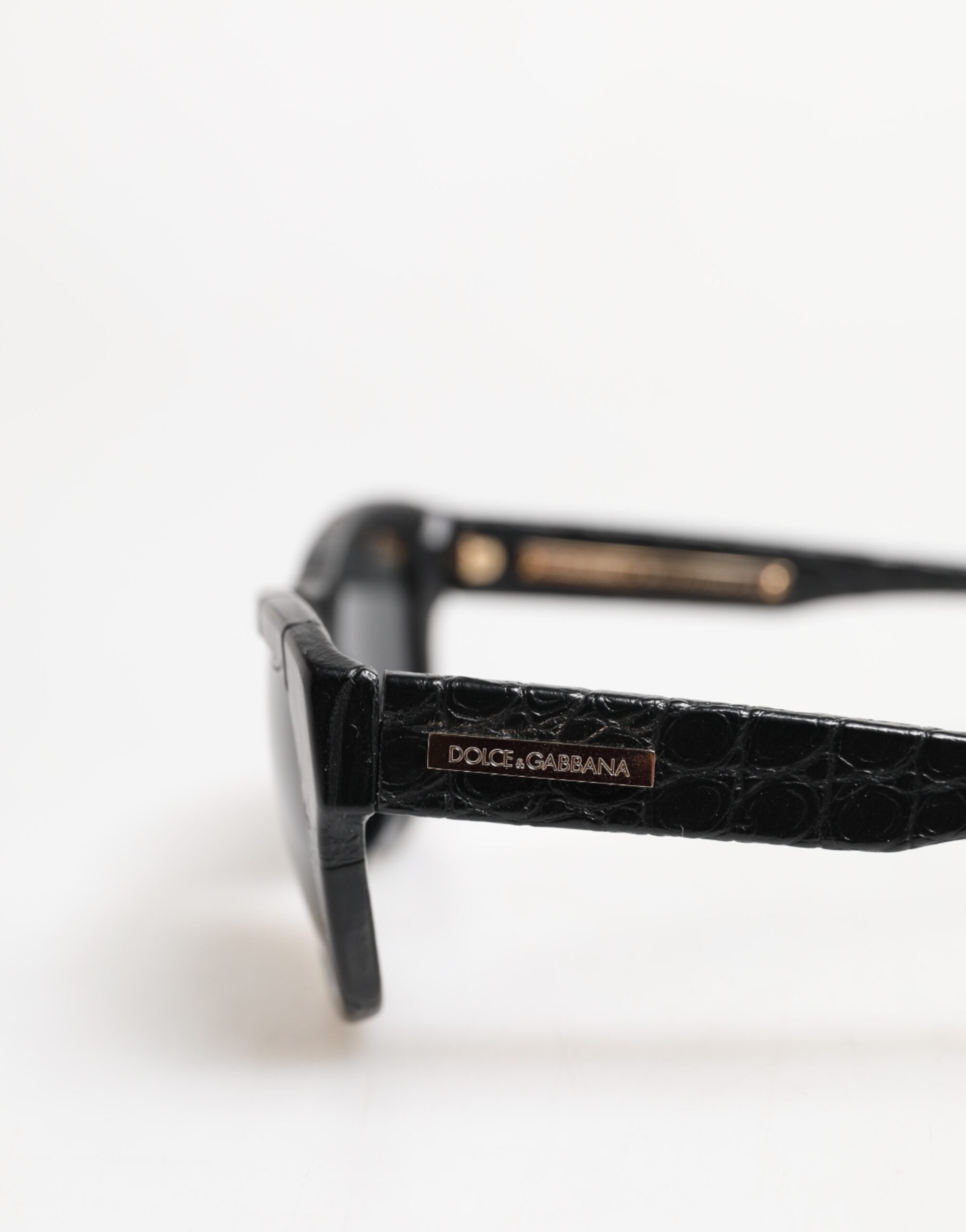 Lunettes de soleil Dolce & Gabbana DG4177 à monture en cuir noir avec verres teintés, style élégant et moderne.