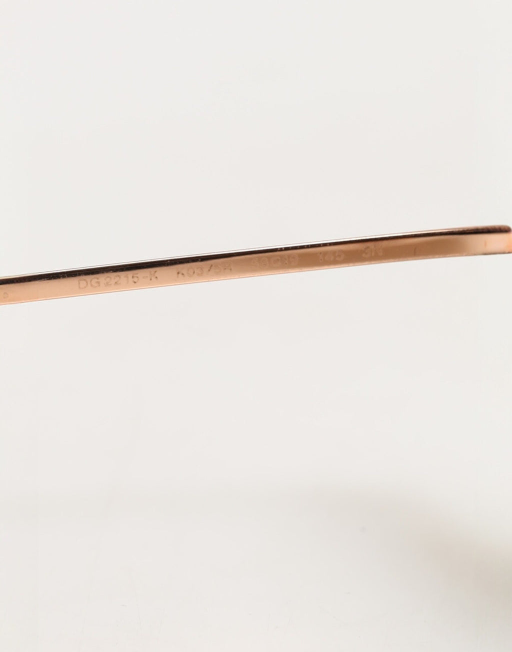 Lunettes de soleil rondes en métal doré Dolce & Gabbana DG2215K, style élégant et moderne, avec monture dorée brillante.