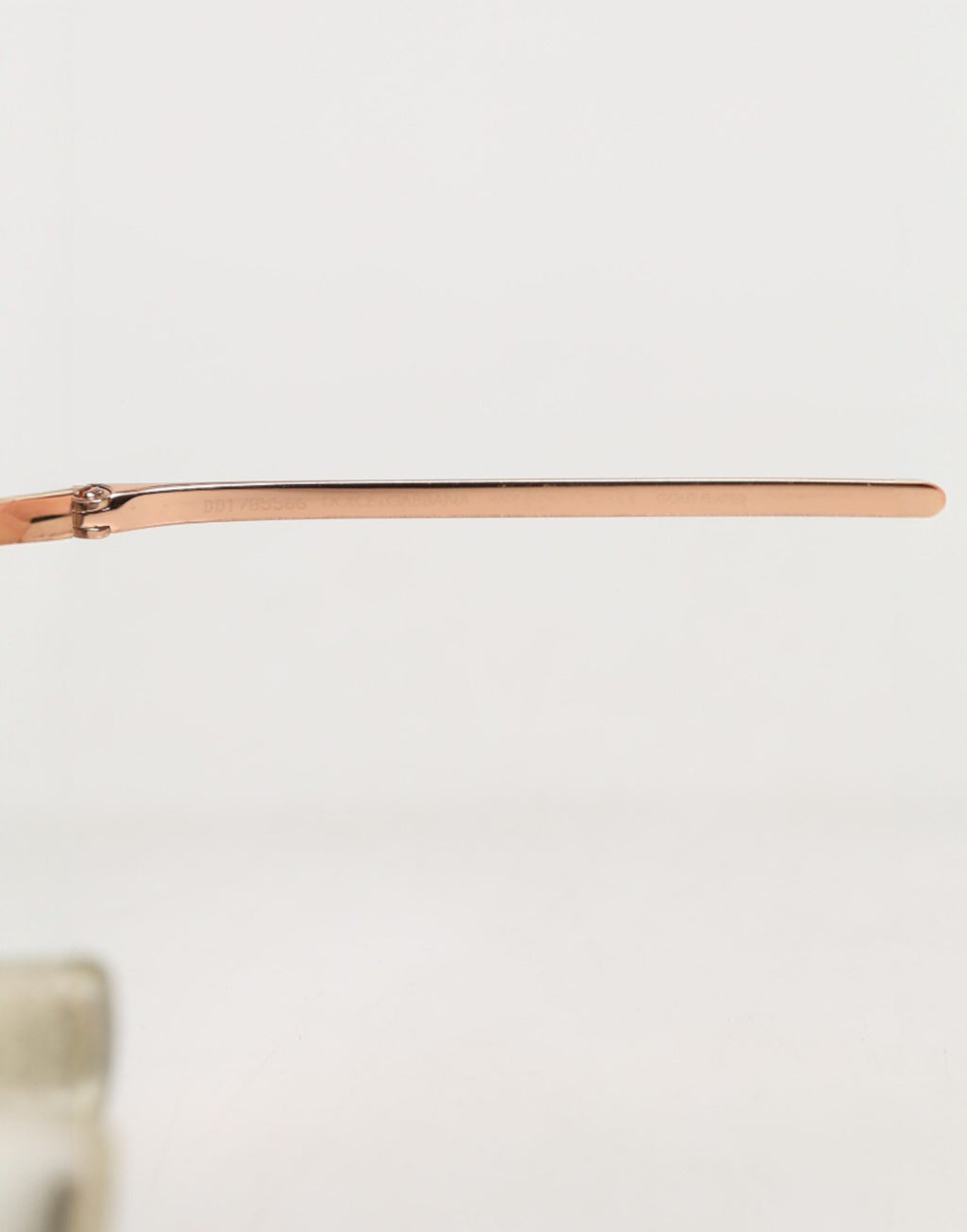 Lunettes de soleil rondes Dolce & Gabbana DG2215K en métal doré, monture ronde élégante pour un style sophistiqué.