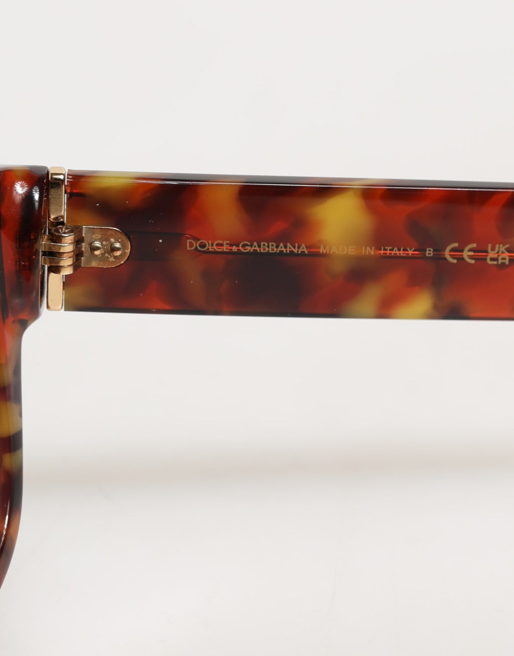 Lunettes de soleil rondes Dolce & Gabbana DG4338F marron avec monture pleine en métal, style Havana.