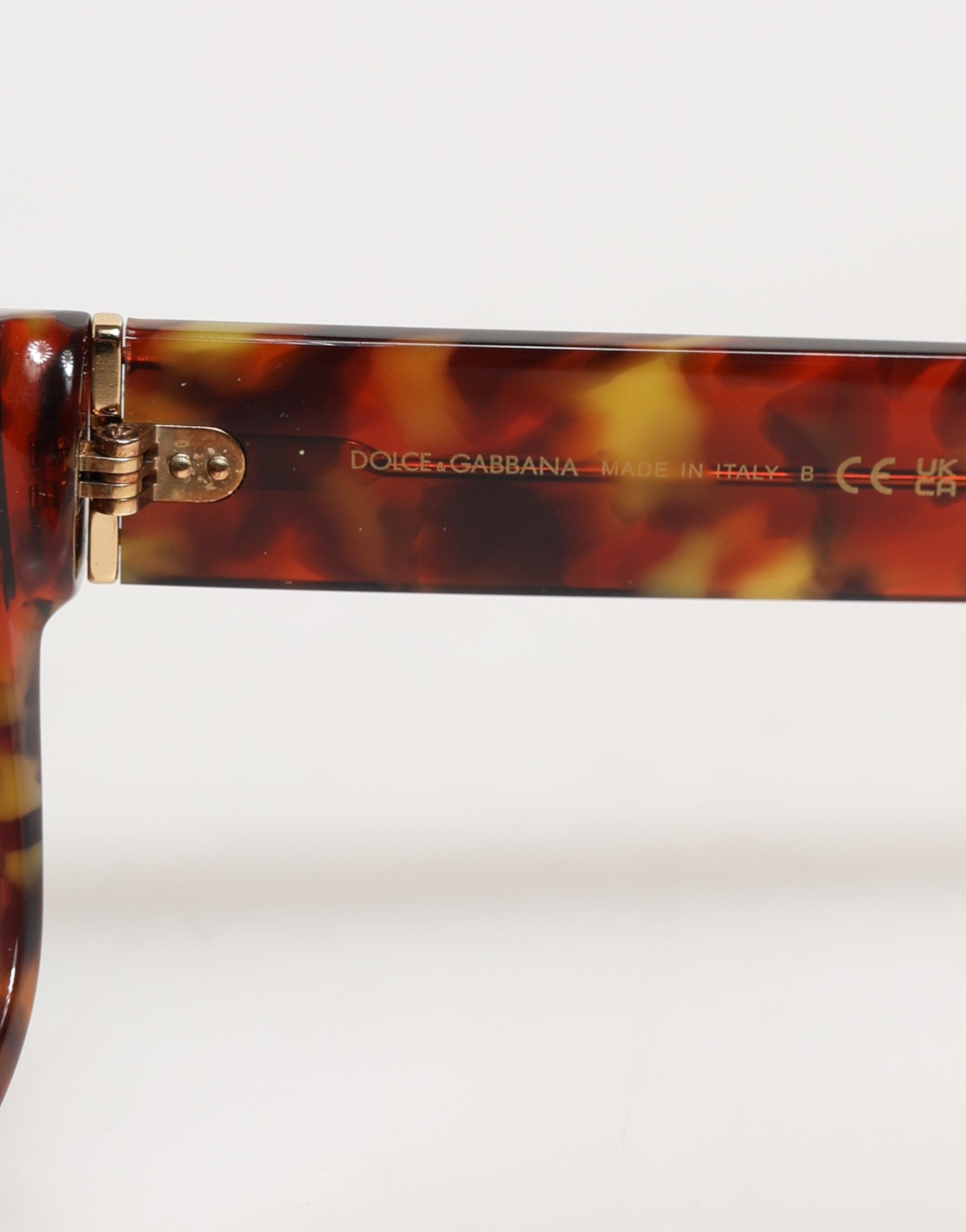 Lunettes de soleil rondes Dolce & Gabbana DG4338F marron avec monture pleine en métal, style Havana.