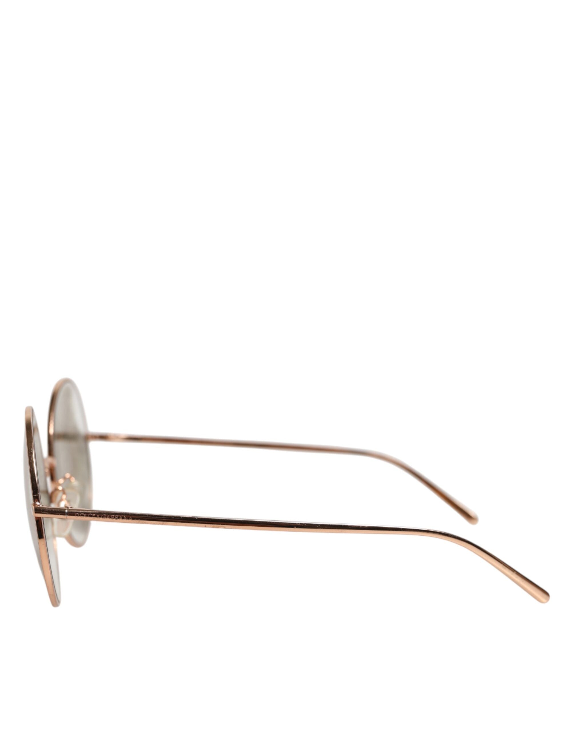 Lunettes de soleil Dolce & Gabbana avec monture ronde en or rose, verres de style élégant.