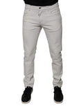 Jeans skinny en coton stretch blanc pour homme de Dolce & Gabbana, vue de face, détails de la coupe ajustée et des poches.